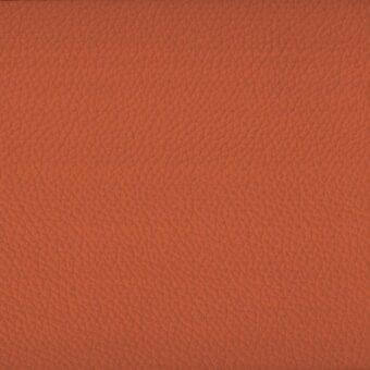 Orange leather texture sample from Sovet Italia, displaying a dense grain and matte finish with subtle sheen and tonal variations.